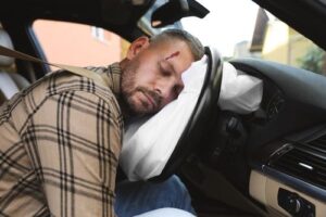 Unconscious driver with traumatic brain injury from car accident