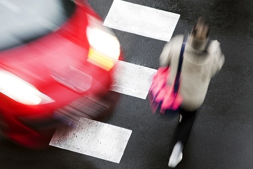 Smyrna pedestrian accident lawyer concept, a car about to hit a pedestrian