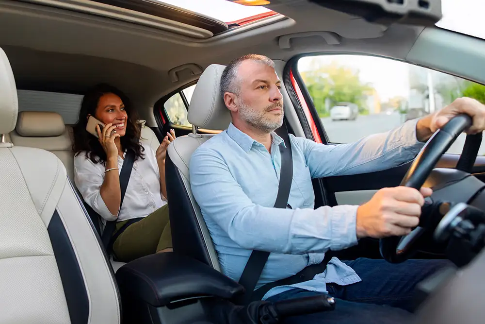 female passenger in lyft car