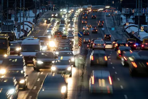 Busy highway at night with lots of cars