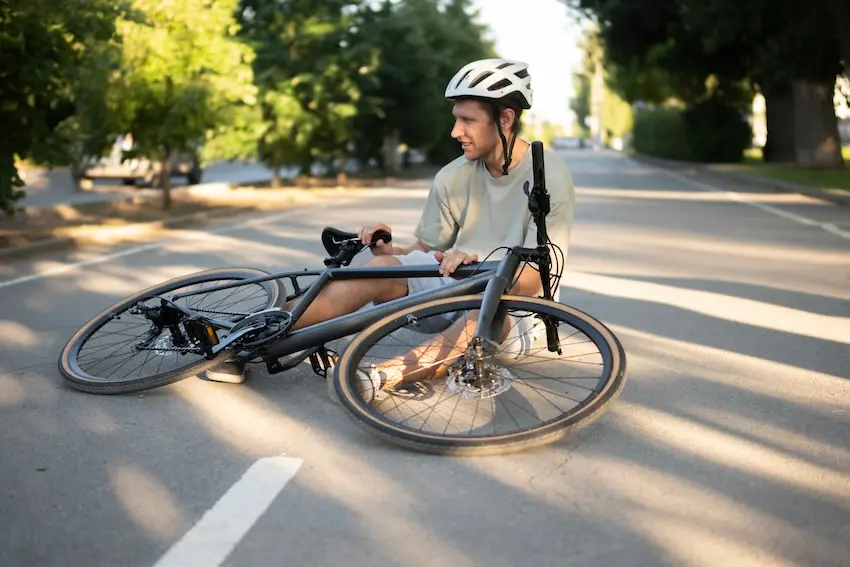 Car door opening into bicycle lane causing dooring accident and cyclist injury