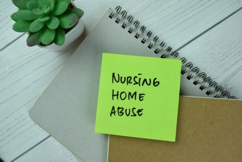 nursing home abuse written on sticky note, nursing home abuse lawsuit concept