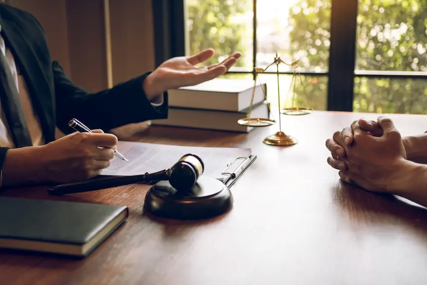 Injured car accident victim meeting with an Alpharetta car accident lawyer at Horst Shewmaker for a free case review
