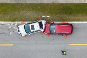 A red and white car crash on a highway in Georgia represents a case to be evaluated by a car accident lawyer.