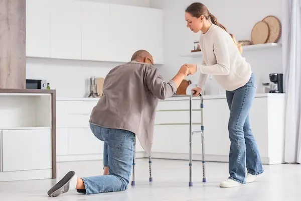 Family caregiver helping a loved one with daily tasks after a disabling injury.